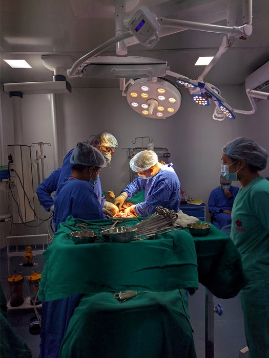 Surgical team performing cancer surgery